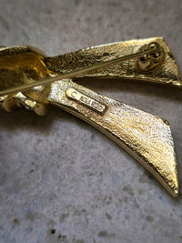 Vintage Nina Ricci Gold-Tone Ribbon Brooch with Rhinestones