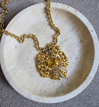 Vintage Nina Ricci Gold Bow Necklace with Amber Glass Center