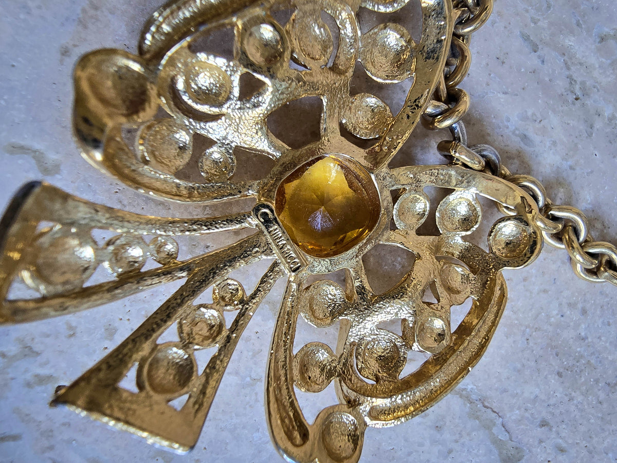 Vintage Nina Ricci Gold Bow Necklace with Amber Glass Center