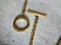 Vintage Nina Ricci Gold Bow Necklace with Amber Glass Center