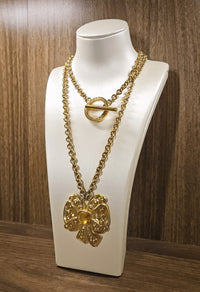 Vintage Nina Ricci Gold Bow Necklace with Amber Glass Center