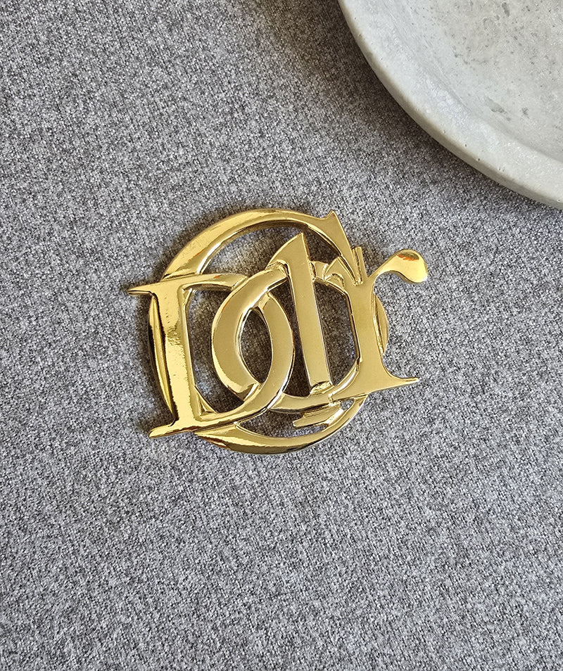 Vintage Christian Dior Gold Logo Brooch
