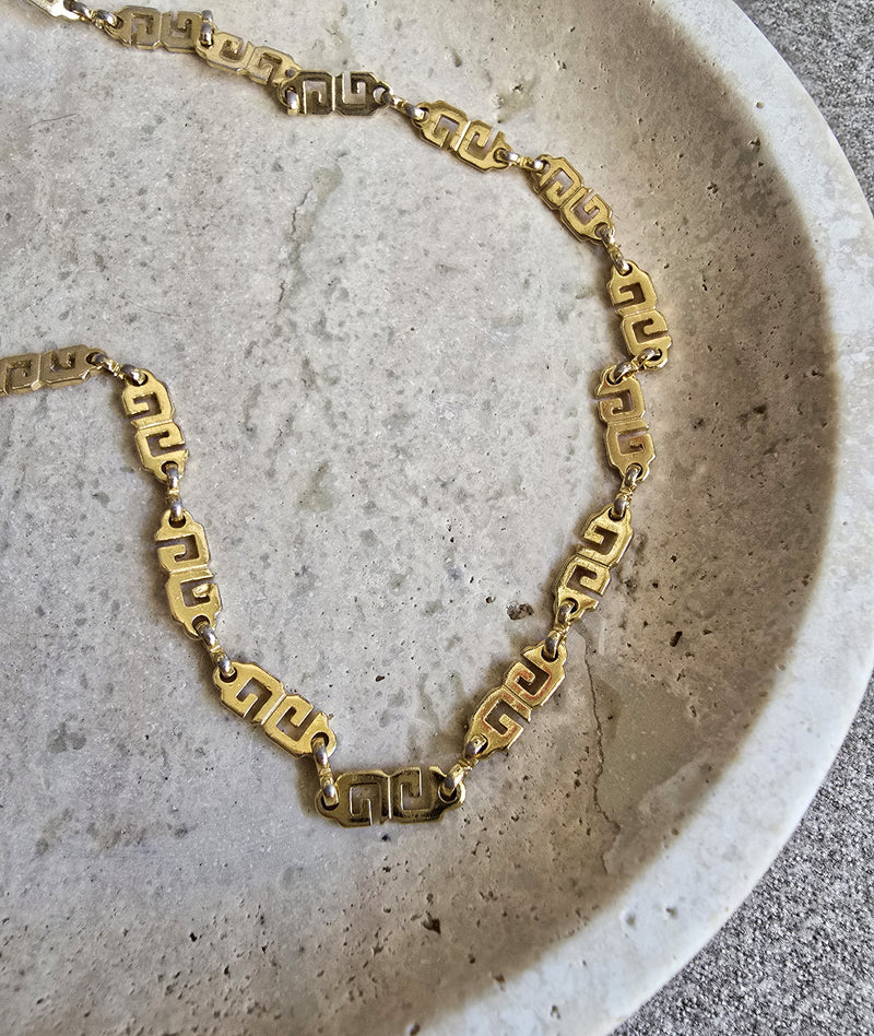 Collier sautoir vintage Givenchy plaqué or à motif GG