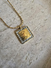 Vintage 1980 Givenchy Logo Pendant Necklace – Gold Tone with Rhinestone Border