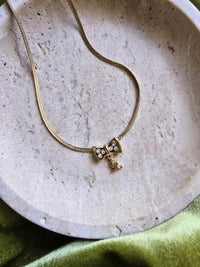 Courrèges Paris Bow Necklace with Logo Charm