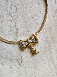 Courrèges Paris Bow Necklace with Logo Charm