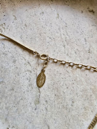 Courrèges Paris Bow Necklace with Logo Charm