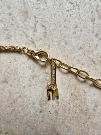 Nina Ricci Gold-Tone Necklace with Blue Crystal Pendant