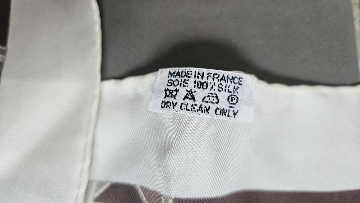 Hermès Triangle Scarf – Ribbon Motif in Neutrals