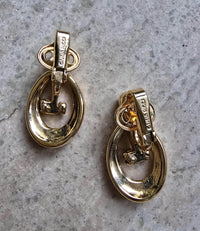 Boucles d’oreilles clip Nina Ricci vintage – Bi-matière doré et argenté, logo NR