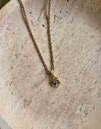 Collier Nina Ricci vintage plaqué or – Pendentif goutte avec strass et logo NR argenté