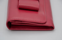 Portefeuille Prada Rouge en Cuir Saffiano avec Noeud et Logo Doré