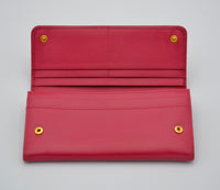 Portefeuille Prada Rouge en Cuir Saffiano avec Noeud et Logo Doré