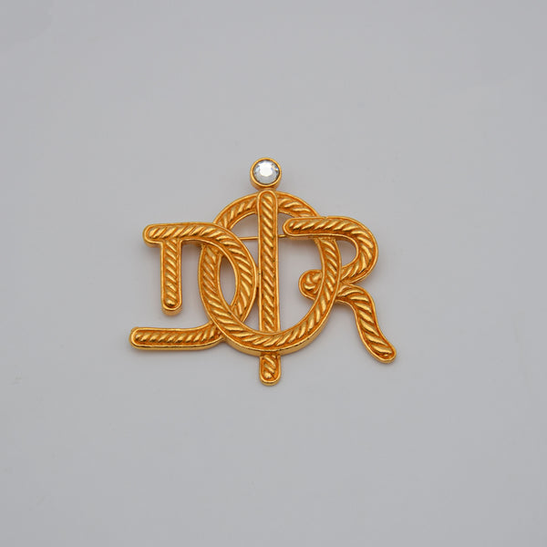 Broche Christian Dior Logo