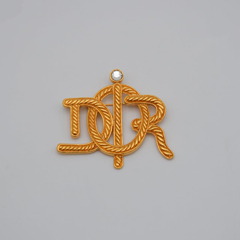 Broche Christian Dior Logo