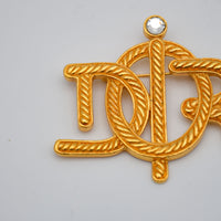 Broche Christian Dior Logo