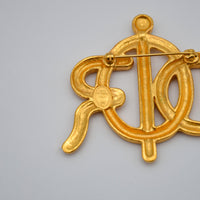 Broche Christian Dior Logo