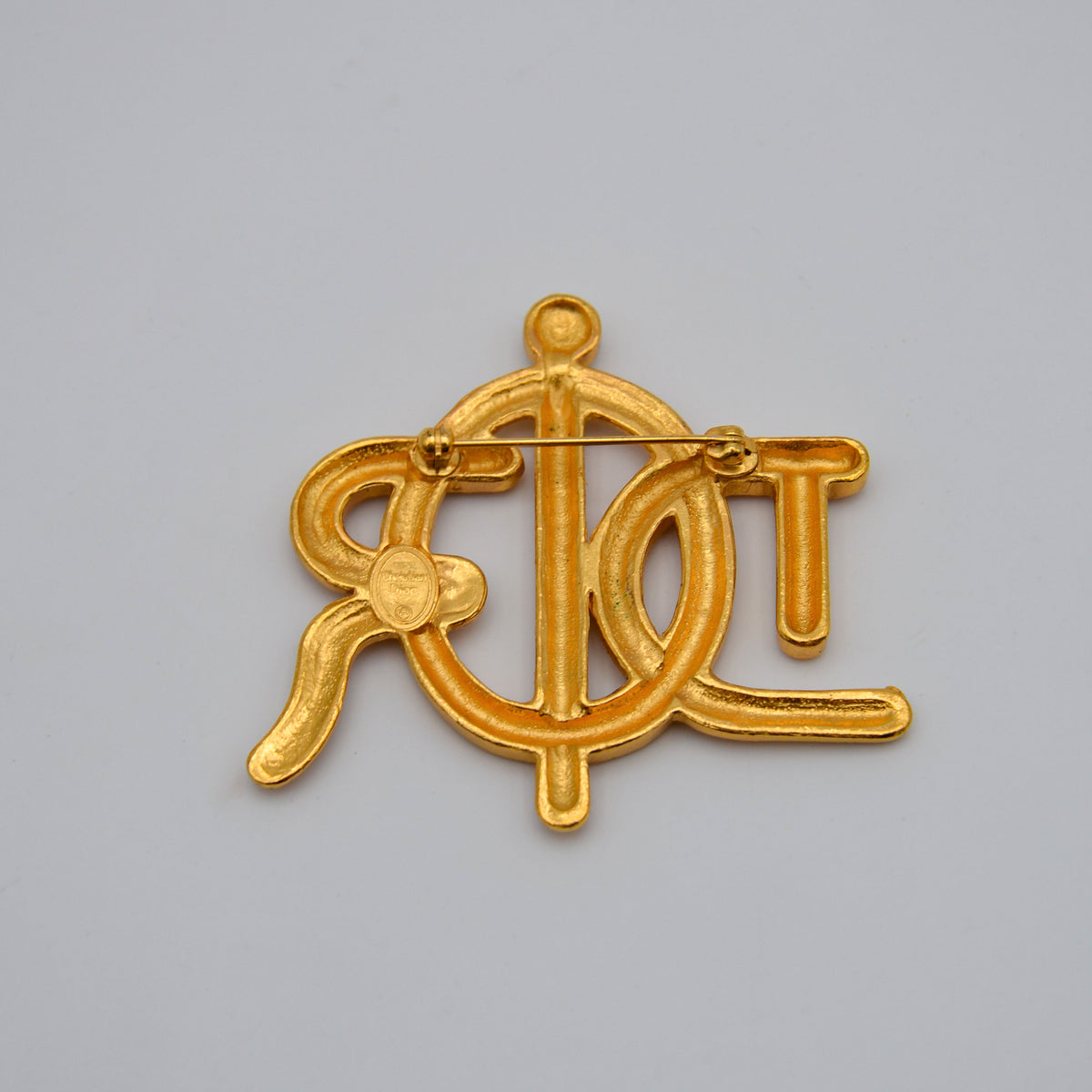 Broche Christian Dior Logo