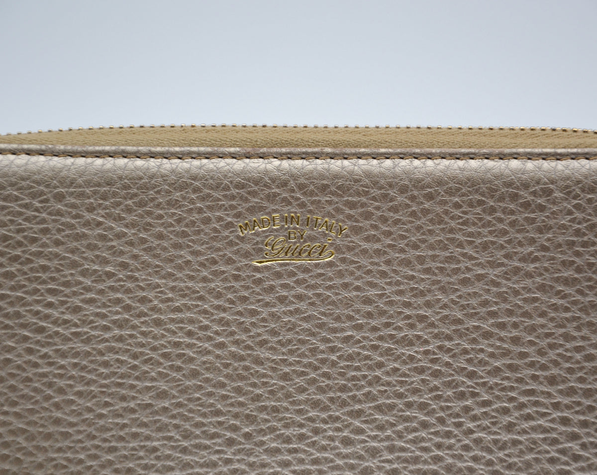 Portefeuille Gucci cuir grainé doré Bamboo zippy