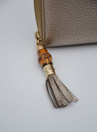 Portefeuille Gucci cuir grainé doré Bamboo zippy