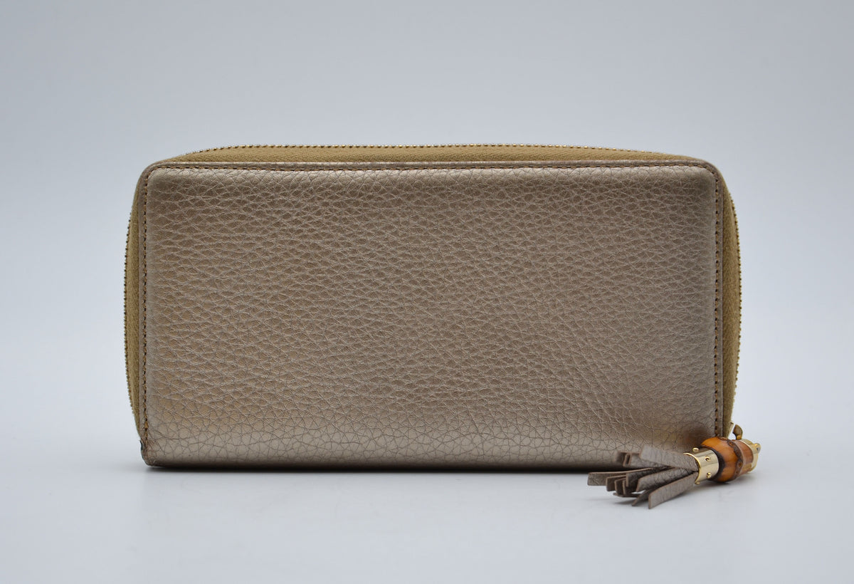 Portefeuille Gucci cuir grainé doré Bamboo zippy