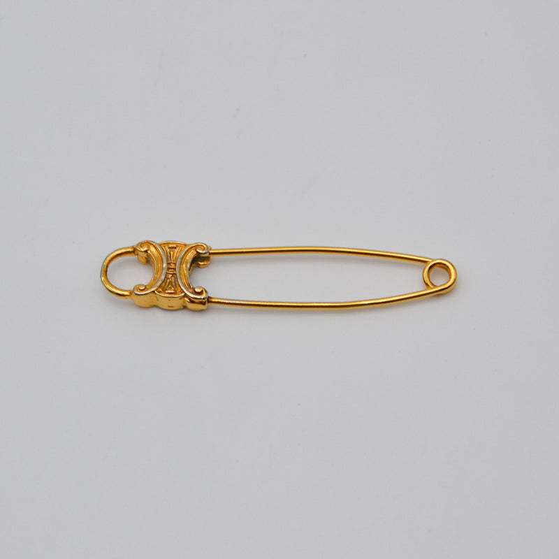 Broche Céline épingle logo Triomphe