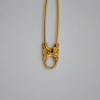 Broche Céline épingle logo Triomphe