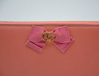 Portefeuille Gucci cuir rose avec nœud GG