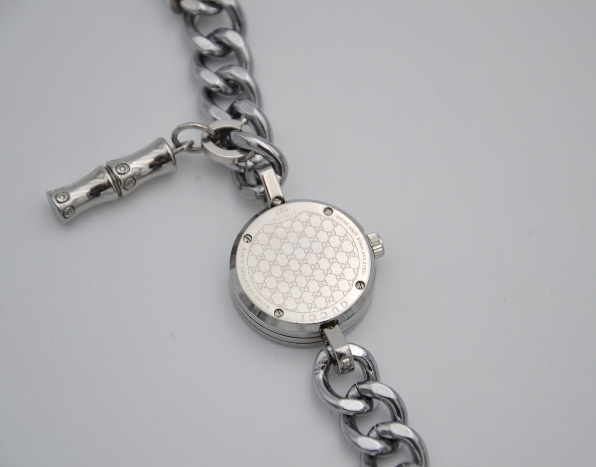 Montre Gucci 107 G vintage à charms