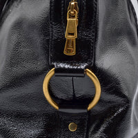 Muse Yves Saint Laurent cuir vernis