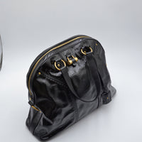 Muse Yves Saint Laurent cuir vernis