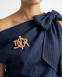 Broche Christian Dior Logo