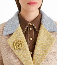 Broche vintage avec logo doré Christian Dior