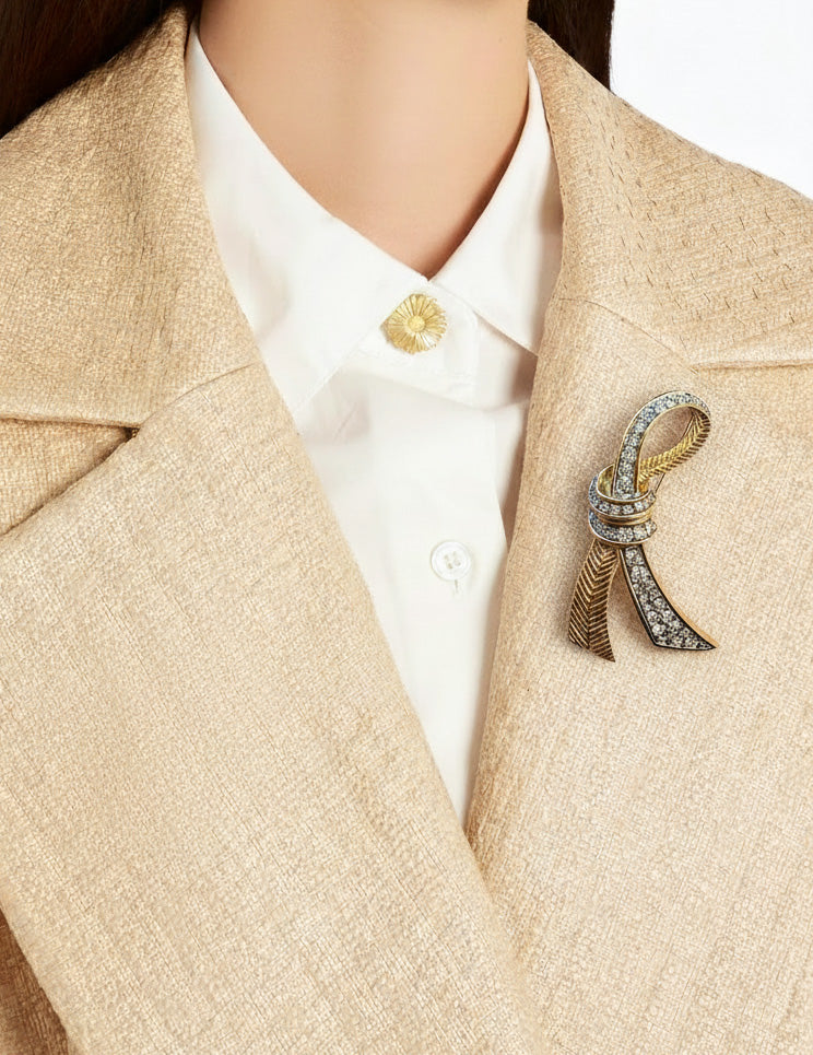 Vintage Nina Ricci Gold-Tone Ribbon Brooch with Rhinestones