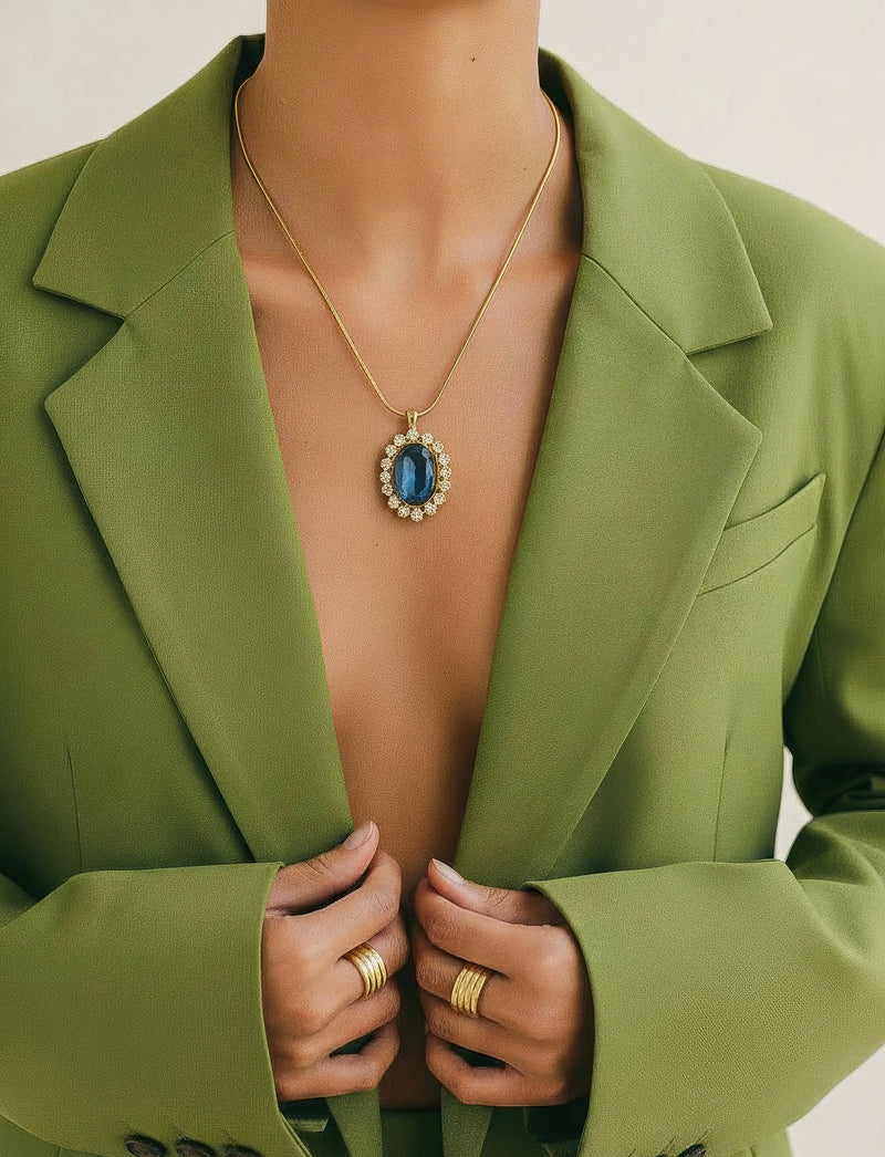Nina Ricci Gold-Tone Necklace with Blue Crystal Pendant