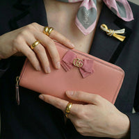 Portefeuille Gucci cuir rose avec nœud GG
