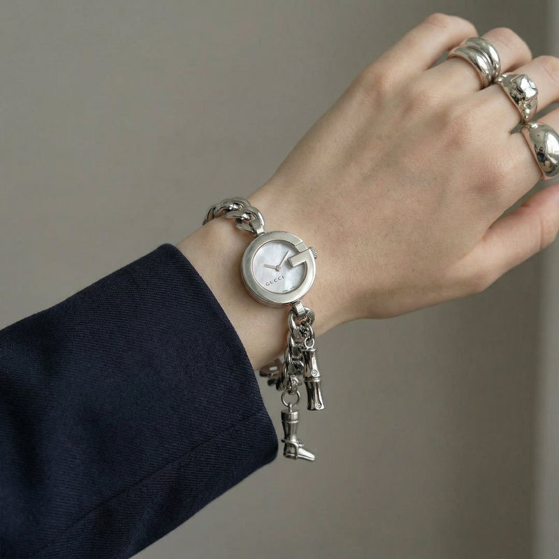 Montre Gucci 107 G vintage à charms