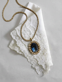 Nina Ricci Gold-Tone Necklace with Blue Crystal Pendant