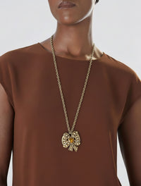 Vintage Nina Ricci Gold Bow Necklace with Amber Glass Center